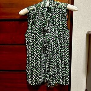 Talbots sleeveless blouse in black/green/ off white prints. Sheer.